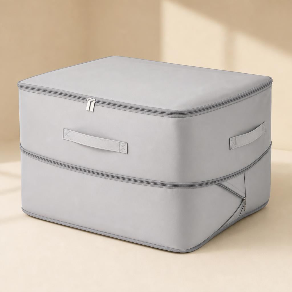 Organizador de ropa autocomprimible gris con asas y doble cremallera
